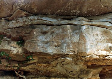 Redbird Petroglyphs at cliff side before the fall 1987